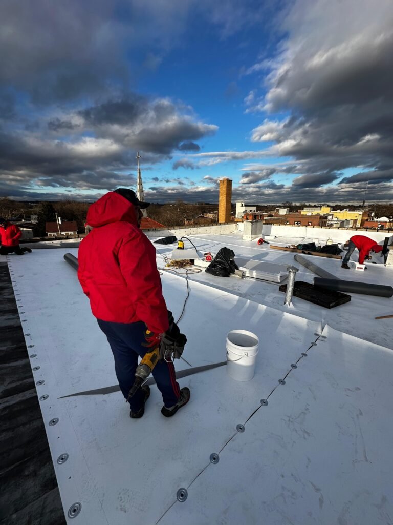 technicians installing commercial roof in Brooklyn